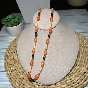 Autumn Colored Lucite Beaded Necklace, in shades of orange, brown, black, cream.